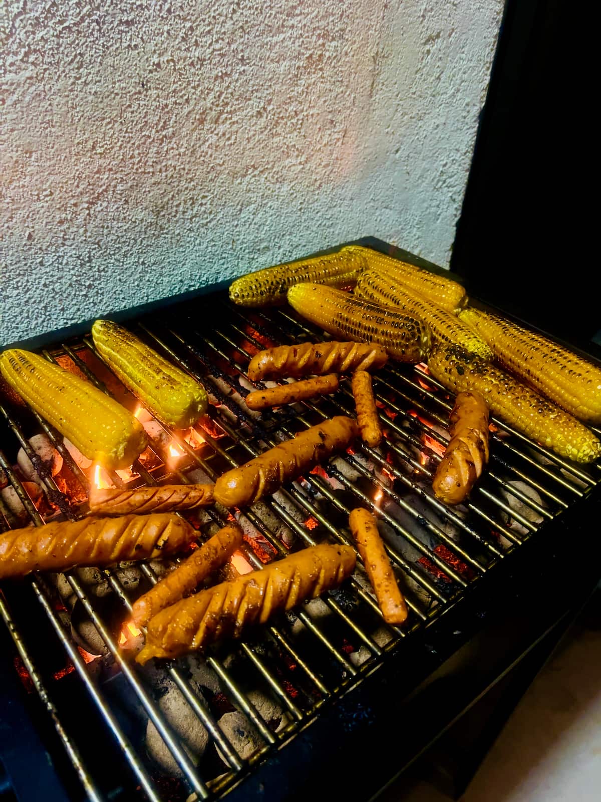 Corn and sausages on the BBQ grill