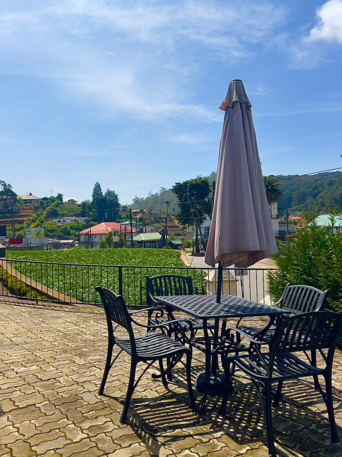 Garden patio with table, chairs and umbrella