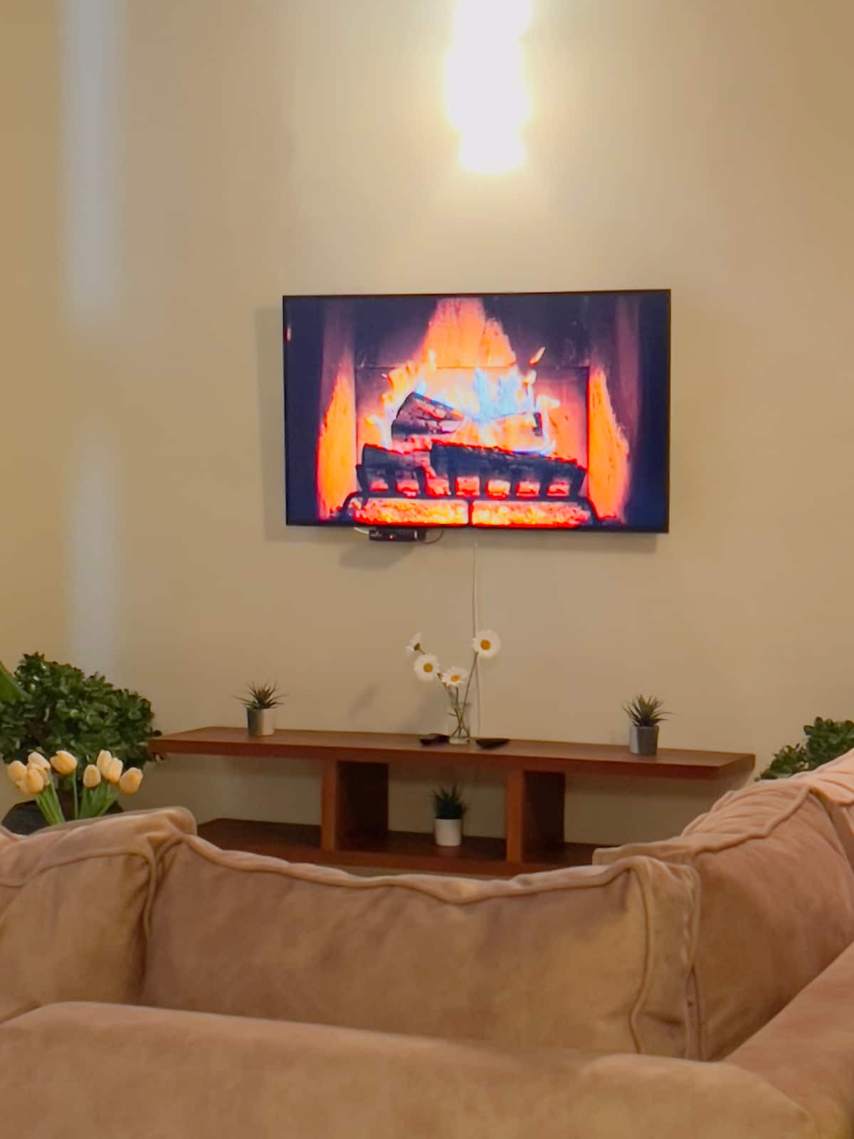 Living room with large TV and sofas
