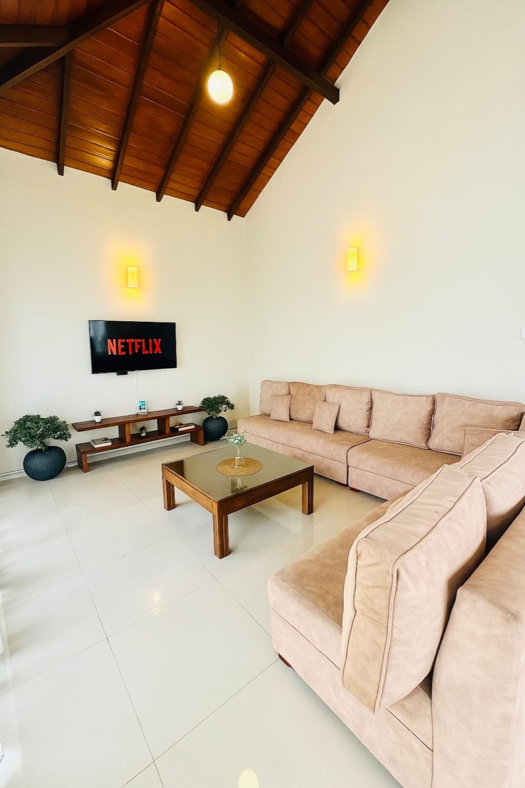 Bright living room with sofa and smart TV